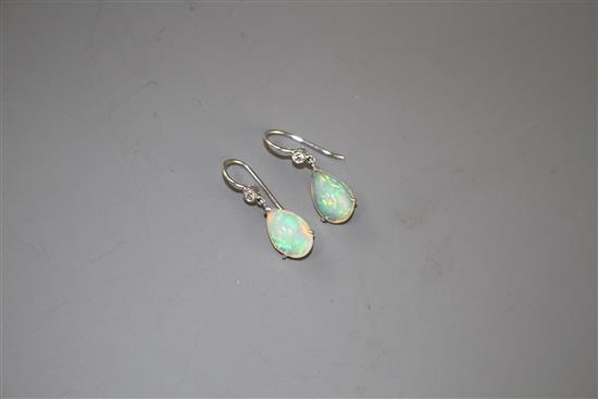 A pair of white metal, pear shaped white opal and diamond set drop earrings, opals approx. 12mm, gross weight 2.7 grams.